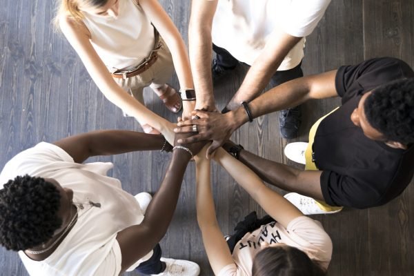 top-view-group-friends-holding-hands